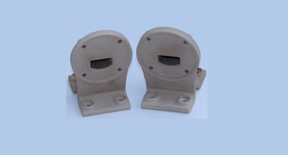 Second redesigned compensated Cable Guide & Conduit printed via PBF process using the compensated geometry.  The back plate surface connecting to the baseplate showed differences in finish and slight subtle irregularities on the surface due to missing areas and defects created during the transfer of the scan model to the compensated model.